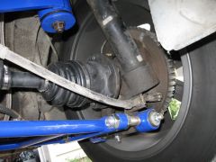 Passenger side axle and control arm